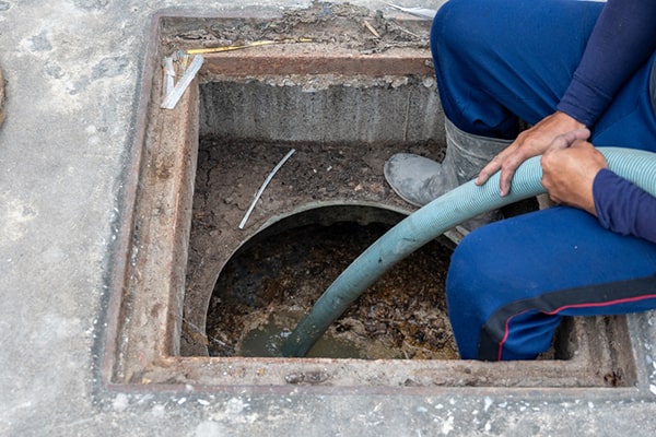 grease trap pumping involves removing built-up grease and solid waste from the trap to prevent clogs and odor